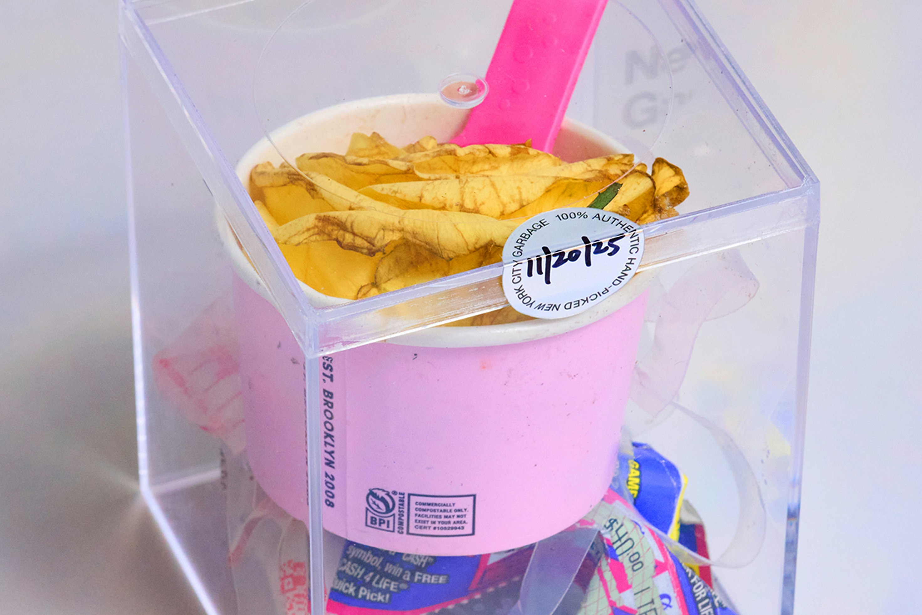 Silver sticker of authenticity on the top backside of each cube with the date the garbage was picked.