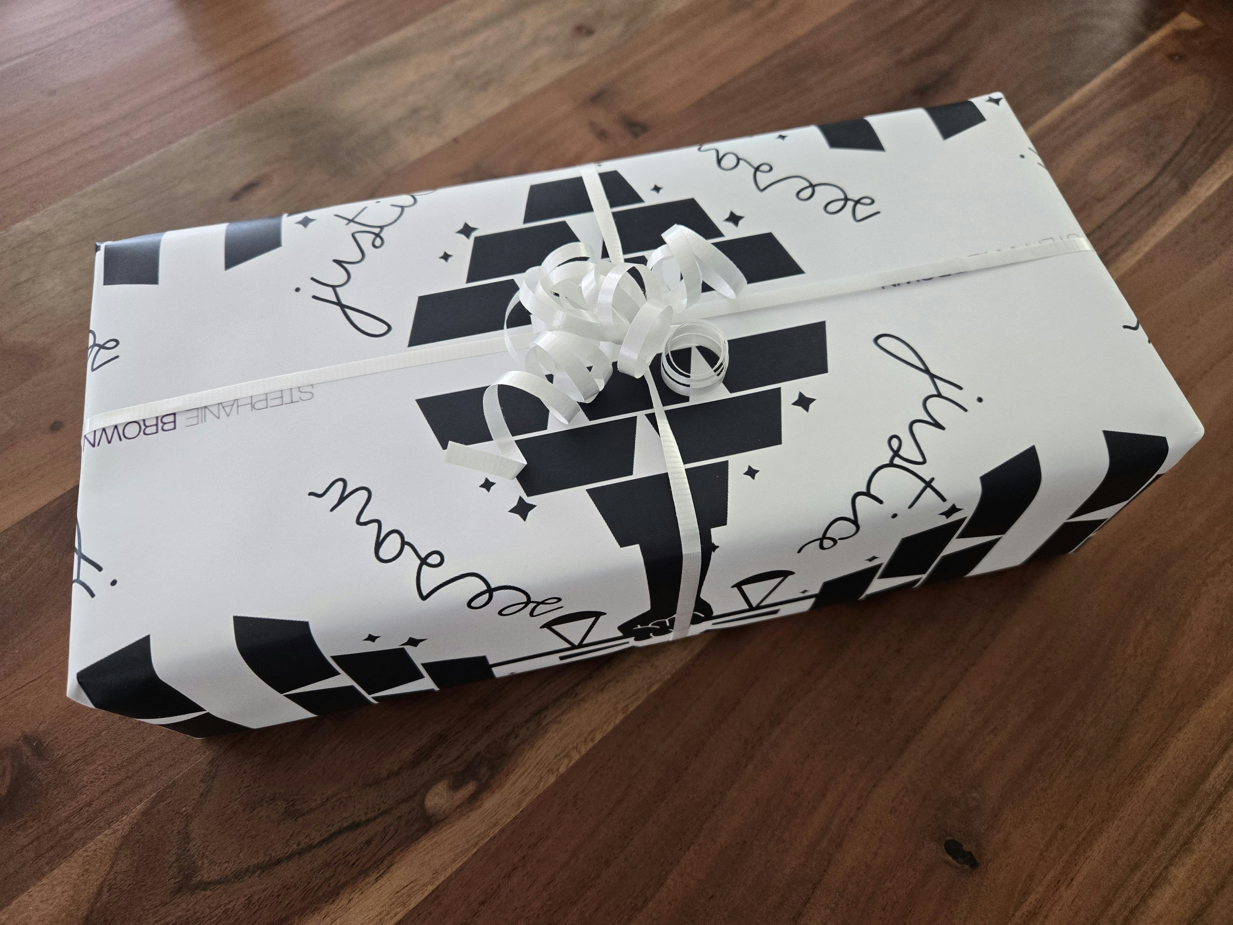 custom wrapping paper and ribbon included.