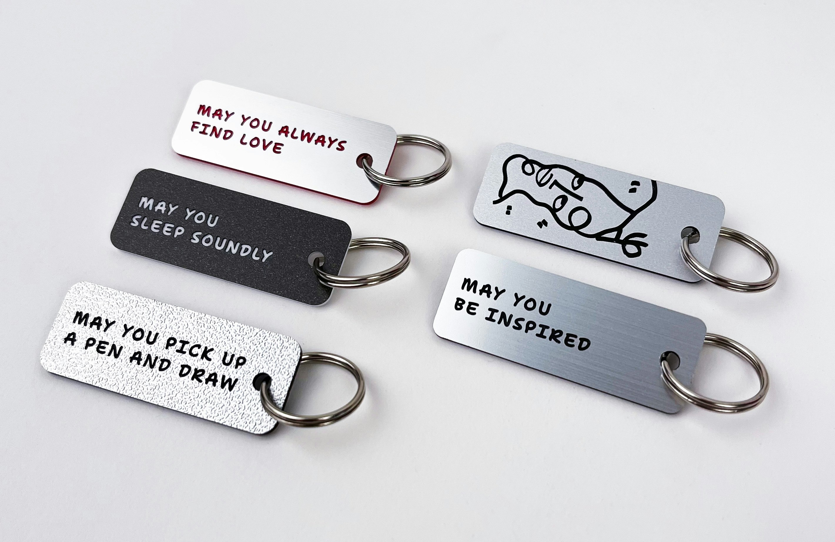 Key tags for the Whitney Shop, by Various Keytags, featuring artwork by Shantell Martin and text in Shantell Sans