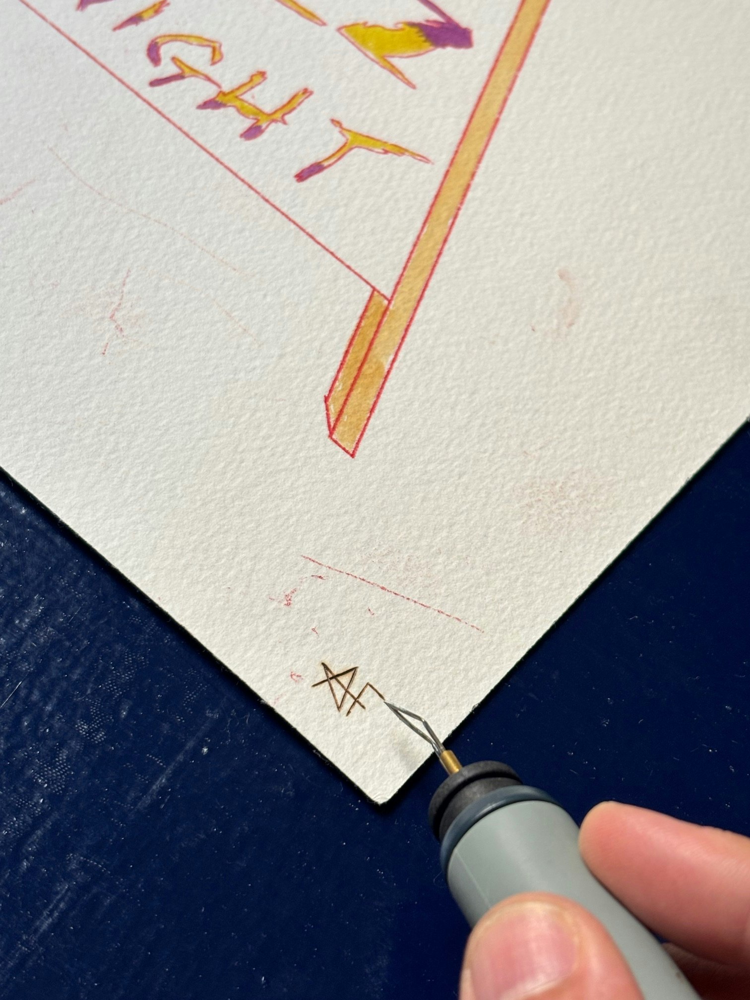 Initials are burned at the corner.
