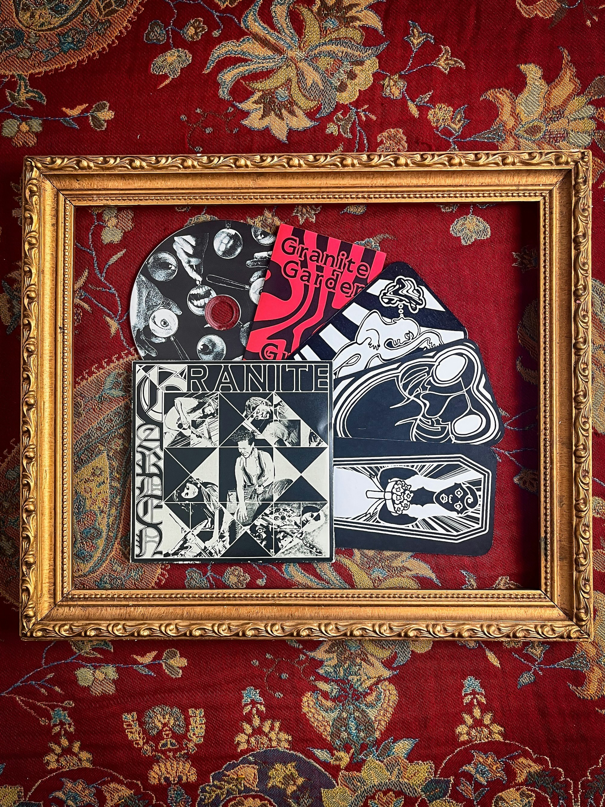 Physical CD, cover art, booklet, and trading cards related to Granite Garden's debut album