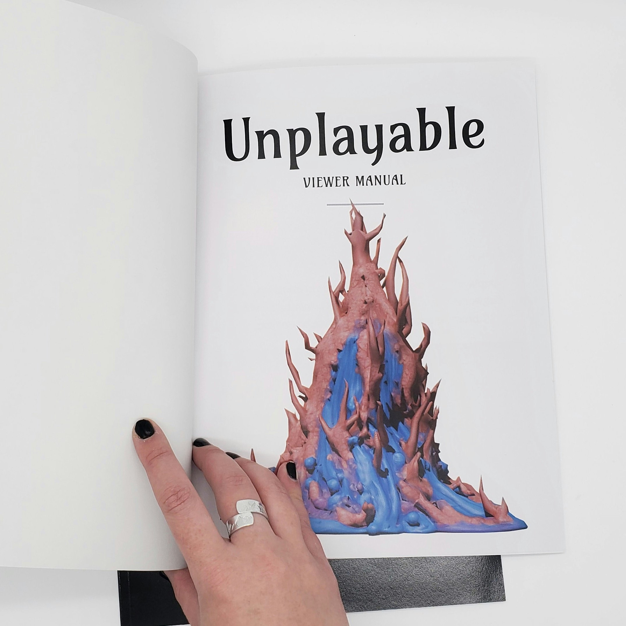 Unplayable title page spread