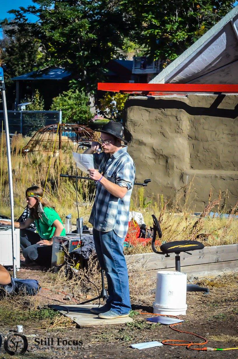 Dank reading poetry at an event at an urban farm in the Denver metro area.